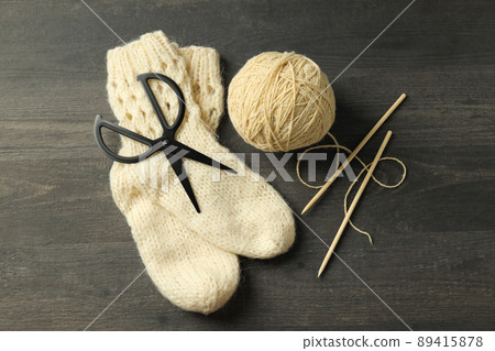 Knitting yarn concept on gray wooden background Knitting yarn concept on gray wooden background 89415878