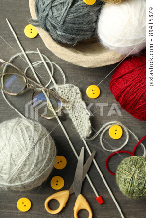 Knitting yarn concept on gray wooden background Knitting yarn concept on gray wooden background 89415879