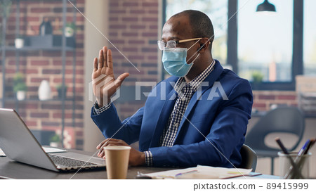 Male employee talking on remote videoconference call, attending business meeting with consultant on laptop. Using online video teleconference chat on internet, webcam remote conversation. 89415999