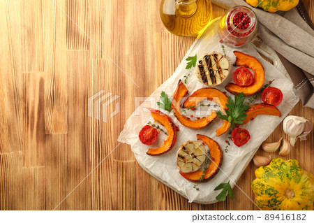 Concept of cooking with baked pumpkin on wooden background 89416182