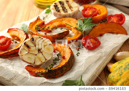 Concept of cooking with baked pumpkin on wooden background 89416183