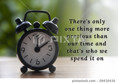 Inspirational quote text with black alarm clock background. Inspirational quote text with black alarm clock background. 89416438