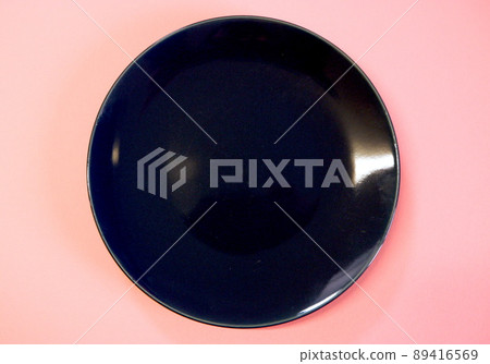 Navy blue plate and pink background 89416569