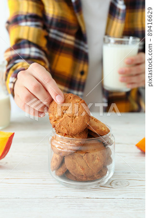 Concept of tasty eating with pumpkin cookies 89416629