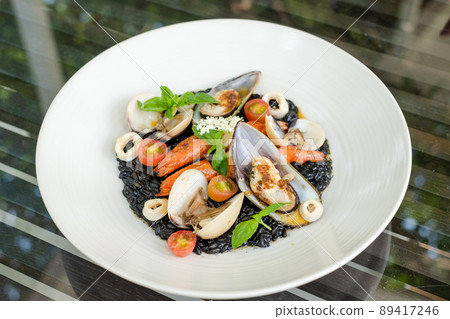 Italian Riso Pasta Tossed in Black Squid Ink & Topped With Shrimps & Mixed Seafood Italian Riso Pasta Tossed in Black Squid Ink & Topped With Shrimps & Mixed Seafood 89417246