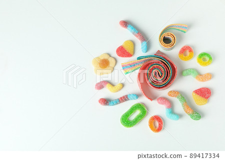 Gummy candies on white background, space for text Gummy candies on white background, space for text 89417334