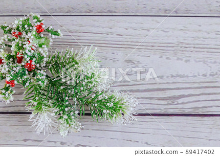 Christmas or New Year background: fur-tree, branches, colored glass balls and toys, gifts, decoration on a white Christmas or New Year background: fur-tree, branches, colored glass balls and toys, gifts, decoration on a white 89417402