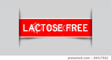 Inserted red color label sticker with word lactose free on gray background Inserted red color label sticker with word lactose free on gray background 89417682