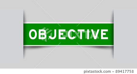 Inserted green color label sticker with word objective on gray background Inserted green color label sticker with word objective on gray background 89417758