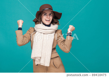 Yes! Gesture woman rejoicing her success. Win sign. Studio shot 89418473