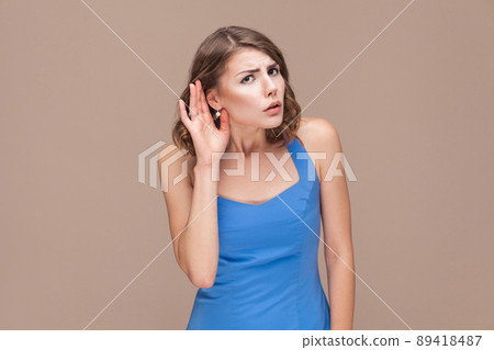 Businesswoman not hear you. Studio shot Businesswoman not hear you. Studio shot 89418487
