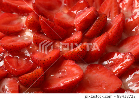 Delicious strawberry tart all over background, close up Delicious strawberry tart all over background, close up 89418722