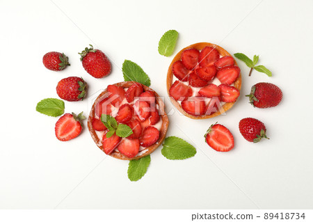 Delicious strawberry tarts on white background, top view Delicious strawberry tarts on white background, top view 89418734