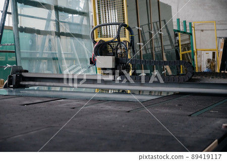 Factory for aluminum and PVC windows and doors production. Details industrial equipment. 89419117