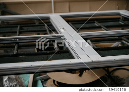 Production and manufacture of window profiles. Plastic and metal profiles close-up 89419156