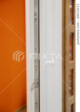 Plastic window handle close up 89419213