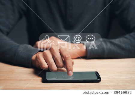Customer support hotline Contact us people connection. Businessman using smartphone with the email, call phone, address, Chat message icons. Customer support hotline Contact us people connection. Businessman using smartphone with the email, call phone, address, Chat message icons. 89419983