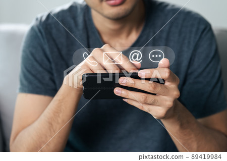 Customer support hotline Contact us people connection. Businessman using smartphone with the email, call phone, address, Chat message icons. Customer support hotline Contact us people connection. Businessman using smartphone with the email, call phone, address, Chat message icons. 89419984