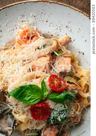 Closeup on salmon tagliatelle pasta 89420503