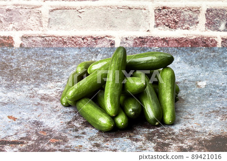 Pile of healthy and ecological baby cucumbers. Healthy snack food Pile of healthy and ecological baby cucumbers. Healthy snack food 89421016