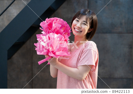 A woman practicing cheerleading 89422113