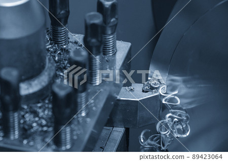 Close-up scene the lathe machine finishing cut the brass shaft parts by lathe tools. 89423064