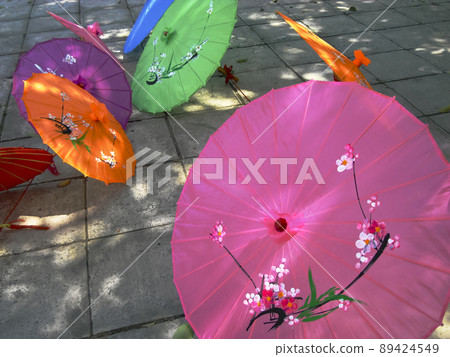 Colorful parasol placed on the street Colorful parasol placed on the street 89424549