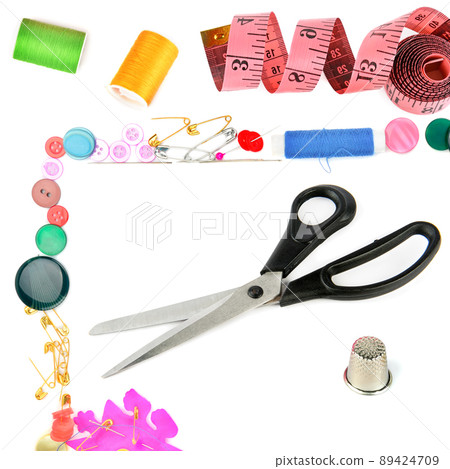 Scissors and other sewing accessories isolated on white 89424709