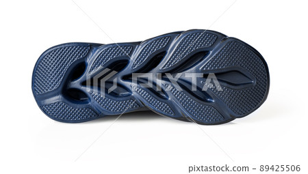 Shoe sole isolated on a white background. Clean bottom of blue sneaker groved sole cutout. 89425506