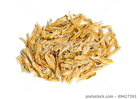 Dried anchovies on white background. 89427391