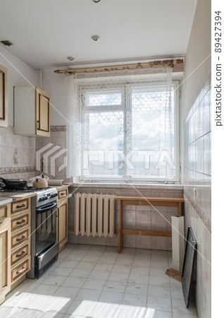 View of old kitchen with wooden shelves. View of old kitchen with wooden shelves. 89427394