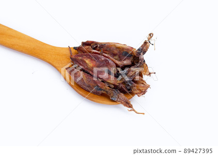 Dried squid on white background. Dried squid on white background. 89427395