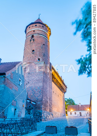 Tower of Castle of Warmian Bishops at dusk in Olsztyn, Poland. 89427885