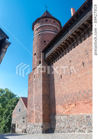 Fortified castle tower of Castle of Warmian Bishops in Olsztyn. Fortified castle tower of Castle of Warmian Bishops in Olsztyn. 89427919