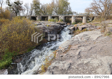 Rocky bank, mountain landscape. View of mountain river in early spring. Nature landscape, wilderness. Tikich river Rocky bank, mountain landscape. View of mountain river in early spring. Nature landscape, wilderness. Tikich river 89427966