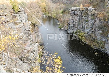 Granite rocks of Bukski Canyon with the Girskyi Tikych River. Picturesque landscape and beautiful place in Ukraine Granite rocks of Bukski Canyon with the Girskyi Tikych River. Picturesque landscape and beautiful place in Ukraine 89427970