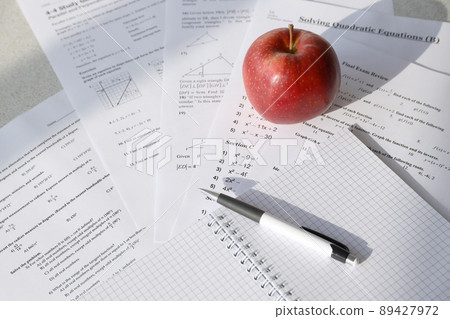 Handwriting of mathematics quadratic equation on examination, practice, quiz or test in maths class. Solving exponential equations concept. Handwriting of mathematics quadratic equation on examination, practice, quiz or test in maths class. Solving exponential equations concept. 89427972