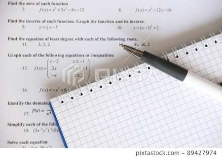 Handwriting of mathematics quadratic equation on examination, practice, quiz or test in maths class. Solving exponential equations concept. Handwriting of mathematics quadratic equation on examination, practice, quiz or test in maths class. Solving exponential equations concept. 89427974