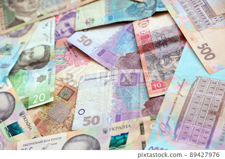 Ukrainian money bills close up. Big amount of hryvnia bills on table. Business and investment Ukrainian money bills close up. Big amount of hryvnia bills on table. Business and investment 89427976