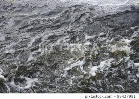 Waves of water of the river and the sea meet each other during high tide and low tide. Deep blue stormy sea water surface with white foam and waves pattern, background photo Waves of water of the river and the sea meet each other during high tide and low tide. Deep blue stormy sea water surface with white foam and waves pattern, background photo 89427981