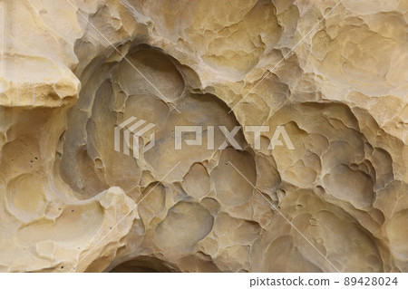 Combination of stone relief like a orange planet surface. Brown stone with abnormal relief shape 89428024