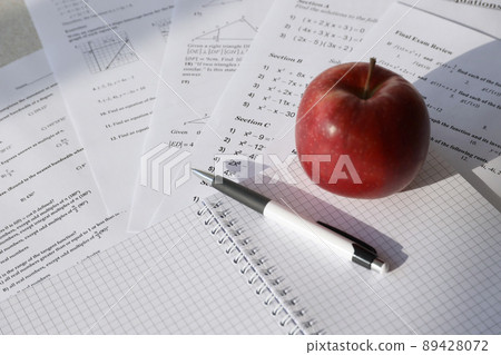 Handwriting of mathematics quadratic equation on examination, practice, quiz or test in maths class. Solving exponential equations concept. Handwriting of mathematics quadratic equation on examination, practice, quiz or test in maths class. Solving exponential equations concept. 89428072