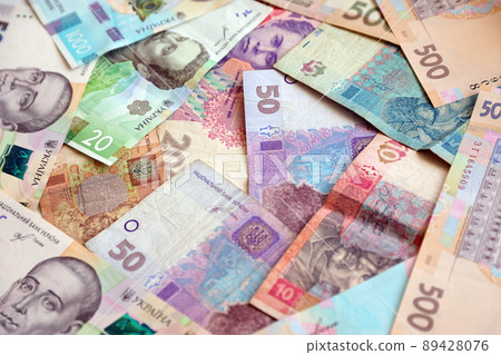 Ukrainian money bills close up. Big amount of hryvnia bills on table. Business and investment 89428076