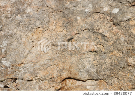 Closeup of the rough stone texture of a big rock surface for natural background concepts. Closeup dirty natural stone background texture Closeup of the rough stone texture of a big rock surface for natural background concepts. Closeup dirty natural stone background texture 89428077