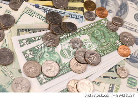 US money bills and coins close up. Big amount of american dollars on table. Business and budget 89428157