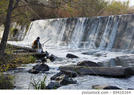 An abandoned dam, an artificial waterfall, the dam of the Butka HPP, is located up the river behind the bridge over the Hirsky Tikich An abandoned dam, an artificial waterfall, the dam of the Butka HPP, is located up the river behind the bridge over the Hirsky Tikich 89428164