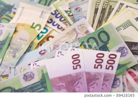 Euro and dollar money bills and coins close up. Big amount of money on table. Business concept. Popular and important currency 89428165