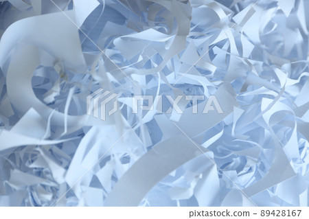 Shredded paper texture background, top view of many white paper strips. Pile of cut paper like box filler for shipping fragile items 89428167