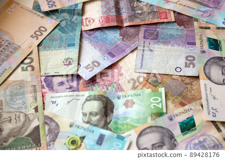 Ukrainian money bills close up. Big amount of hryvnia bills on table. Business and investment Ukrainian money bills close up. Big amount of hryvnia bills on table. Business and investment 89428176