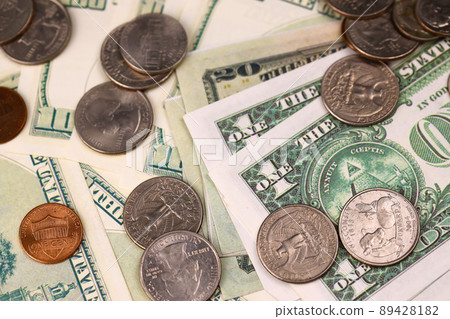 US money bills and coins close up. Big amount of american dollars on table. Business and budget US money bills and coins close up. Big amount of american dollars on table. Business and budget 89428182
